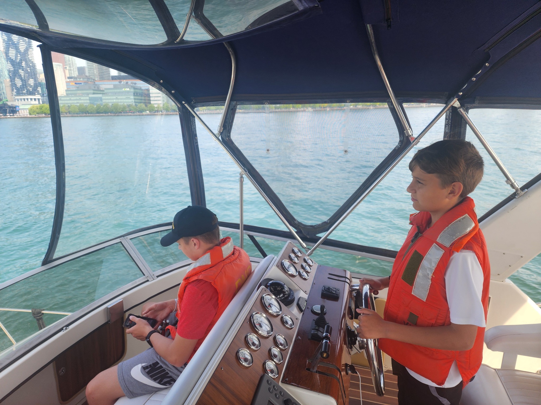Cadet on boat with Toronto skyline